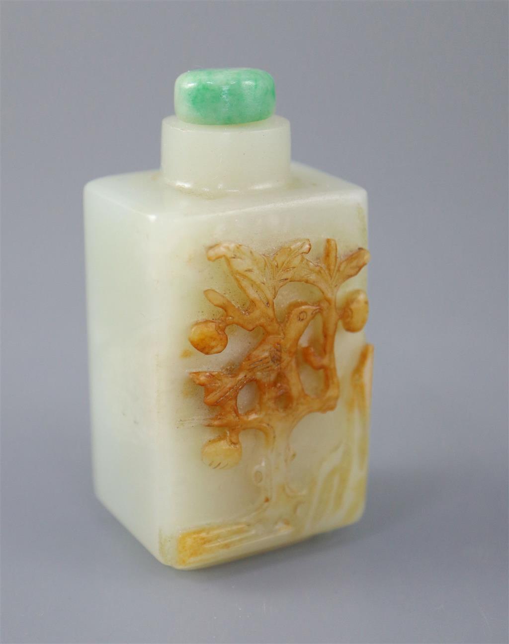 A Chinese pale celadon and russet jade rectangular snuff bottle, 19th century, 5.7cm excl. stopper